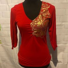 Nwot Dereon Beyonc Top Red In Color Worh Gold Dereon Symbol Size Small~Tts Half Sleeves Open Back Tags:Bright, Open, Gold, Fashion, Beyonc, Trendy, Casual, Style, Youth, Women Festive Red V-neck Top, Fitted Red Top For Festive Season, Stretch Long Sleeve Tops For Festive Occasions, Summer Festive Stretch Tops, Festive Stretch Tops For Summer, Festive Long Sleeve Stretch Tops, Festive Red Long Sleeve Top, Fitted Casual Top For Festive Occasions, White Short Sleeve Tops