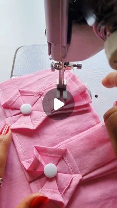 someone is using a sewing machine on a pink shirt