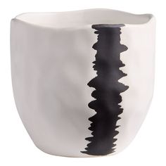 a black and white vase sitting on top of a table