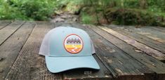 "I am at home among the trees." - J.R.R. Tolkien This trucker hat was inspired by the trails we love so much. It is a cotton/polyester blend with a snapback closure. This hat is an original design created by Kristin H. at NeverEndingSummer.    It comes in 4 different colors including : Blue & Gray (picture) Orange & Blue  Teal & Blue  Gray & Gold Blue Curved Brim Hat For Hiking, Blue Curved Brim Hat For Camping, Blue Curved Bill Hat For Outdoor Activities, Blue Trucker Hat For Camping, Blue Snapback Hat For Hiking, Cotton Trucker Hat For Camping, Blue Gray Gold, Adventure Hat, Grey Pictures