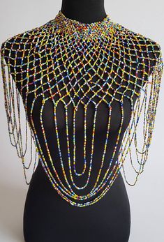 "This shoulder necklace is 100% handmade. Perfect for weddings , African themed events, cultural events or any other event. The list is endless.... Color; multicolor. Size; 22\" long for the longest strand. 16\" around the neck. **Buy multiple items and pay shipping for 1 item only.The rest ships free. More neckleces here; https://www.etsy.com/shop/TribalTess?ref=seller-platform-mcnav&section_id=21306083 Back to my shop; https://www.etsy.com/shop/TribalTess?ref=seller-platform-mcnav" Handmade Multicolor Bridal Necklace With Round Beads, Wedding Multicolor Beaded Chain Beads, Multicolor Beaded Chain Necklace For Wedding, Multicolor Beaded Necklace For Wedding, Bohemian Multicolor Beaded Necklaces For Wedding, Bohemian Multicolor Beaded Necklace For Wedding, Multicolor Large Beads For Wedding, Bohemian Multicolor Bridal Necklace With Round Beads, Rainbow Beaded Necklaces For Party