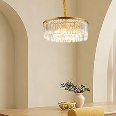 a chandelier hanging over a dining room table