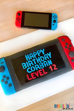 a birthday cake made to look like a video game console with the words happy birthday corbian level 1 on it