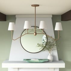 a white mantle with a mirror and some lamps on it in front of a green wall