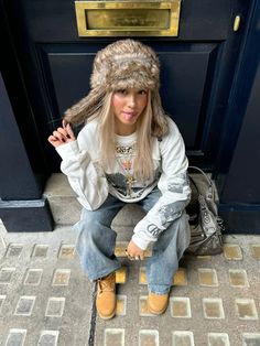 Oakley Beanie Outfit, Winter Fits Going Out, Fur Trapper Hat Outfit, Weird Street Fashion, Aviator Hat Outfit, Eurotrash Aesthetic, Trapper Hat Aesthetic, Dress With Jeans Outfit, Russian Hat Outfit