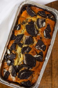 an oreo cookie bread in a pan on a wooden table