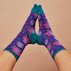 Be inspired by the playful colors of these super comfy knit socks. Laurel's vivacious hot pink florals bloom on a field of bright purple and teal to put spring in your step all year long! Item Number: WNC3235-PRP Size: 9-11 fits U.S. women’s shoe sizes 5-10.5 Material: 56% Nylon/39% Cotton/3% Spandex/2% Other Fiber Casual Purple Socks As Gift, Casual Purple Socks For Gift, Fun Multicolor Socks For Spring, Casual Purple Socks For Gifts, Fun Multicolor Spring Socks, Comfortable Purple Cotton Socks, Playful Multicolor Super Soft Socks, Laurel Burch Art, Playful Colors