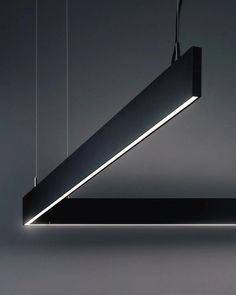 a suspended light fixture in the shape of a rectangle