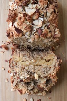 slices of cake sitting on top of a cutting board next to nuts and other toppings