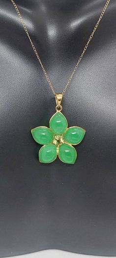 "GREEN Jade/ Peridot Flower 14k Yellow Gold Pendant 18\" Yellow Gold Chain. Jade/Peridot Flower Pendant. Flower Necklace. Flower Petal Jewelry. Petal Necklace. Green Jade Flower LOVER. Product Info: - Pendant Measures: 28x22mm - Stone: Green Jade / Peridot. - Stone Color: Green. - Metal: 14k Yellow Gold - Chain Length: 18 Inches. - Nice Gift Box Included." Fine Jewelry With Green Flower-shaped Gemstones, Fine Jewelry With Green Flower Design, Fine Jewelry In Green With Flower Shape, Fine Jewelry In Flower Shape And Green Color, Fine Green Jewelry In Flower Shape, Green Flower Pendant Jewelry For Wedding, Green Flower-shaped Fine Jewelry, Green Flower Pendant Necklace For Anniversary, Green Flower Pendant Fine Jewelry