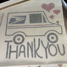 an envelope with the words thank you written on it and a mail truck drawn in front