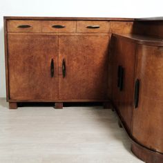 a large wooden cabinet with two doors and drawers