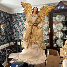 a statue of an angel in a living room