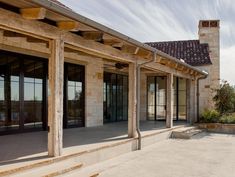 an outside view of a building with glass doors and stone steps leading up to it