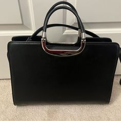 Bag Was Gift Came With Original Plastic Bag Excellent Condition Only Used Handful Of Times Very Large Bag With 3 Sections Center Interior Zippered Compartment Has Removable Black Leather Strap Color Black Silver Accents H10” X L14” X D19” Black Leather Satchel, Leather Satchel Bag, Satchel Bag, Large Bag, Silver Accents, Leather Satchel, Satchel Bags, Large Black, Plastic Bag