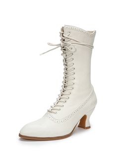 Step into timeless elegance with these exquisite Victorian-inspired lace-up boots. Designed with a sophisticated two-tone color palette of black and white, these boots capture the historical charm of the Regency era while offering a modern, comfortable fit. The pointed toe and elegant lace-up design evoke the refined styles of the 19th century, making these boots a perfect addition to any vintage-inspired wardrobe. Features: Crafted from premium soft napa leather for a luxurious feel Detailed lace-up front with precise stitching for a classic look Sturdy 7 cm (2.75 inches) heel for added height and comfort Cushioned leather insole and pigskin lining for a comfortable wear Non-slip rubber outsole for stability These boots are ideal for lovers of Regency-era fashion and vintage-inspired outf Simple Satin Wedding Dress, Two Tone Boots, Nontraditional Wedding Dress, Wardrobe Vintage, Wedding Dresses High Low, Champagne Evening Dress, Regency Era Fashion, Tulle Ruffles, Fairy Wedding Dress