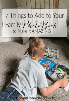 a young boy sitting on the floor reading a book with text overlay that reads 7 things to add to your family photo book to make it amazing