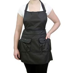 a woman wearing an apron posing for the camera