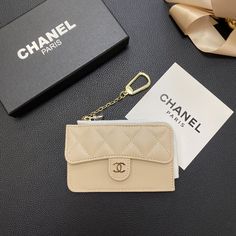 Luxurious Chanel Design: The wallet card holder features Chanel's signature elegance, showcasing the brand's iconic aesthetic. This timeless design adds a touch of sophistication and luxury to any ensemble. Premium Genuine Leather: Crafted from high-quality genuine leather, this wallet card holder provides a luxurious texture and exceptional durability. The leather construction ensures a long-lasting, stylish accessory. Secure Zipper Closure: The wallet is equipped with a secure zipper closure, ensuring that your cards and cash are safely stored. The zipper adds an extra layer of protection, preventing accidental loss of contents. Multiple Card Slots: Designed with multiple card slots, this wallet offers ample space for organizing your credit cards, IDs, and other essential items. The orga Iconic Aesthetic, Chanel Art, Bling Phone Cases, Chanel Design, Zippers Fashion, Luxury Phone Case, Luxury Card, Genuine Leather Wallets, Chanel Paris