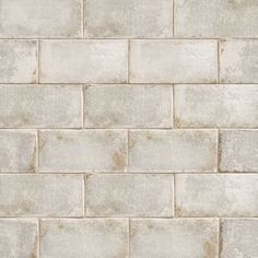 a white brick wall textured with cement