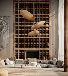 a living room filled with lots of furniture next to a wall covered in wooden lattices