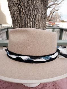 Ready to add a little twist to your brim? The band is 22.5" x 1.5" and has adjustable ties in the back so it can fit hats from 22.5-34". The bottom layer is soft black suede that will look good on all hats. The top layer has is silk ribbons that have been braided to complement the leather and really bring the colors to life. The blue, white, silver and black will compliment your hat. As with all of our custom-made pieces each piece is unique and little different each time made. Please let us kno Designer Name, Silk Ribbon, Soft Black, Fitted Hats, White Silver, Black Suede, Blue White, Product Launch, Twist