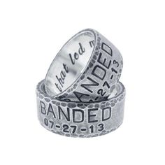 two wedding rings with the words, i am loved and banded written on them