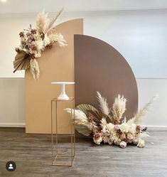 an arrangement of flowers and plants on display in a room