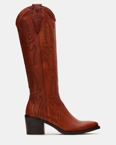 Expertly crafted for Western-style and durability, our SALOON boots feature a pointed toe, knee-high silhouette, and whipstitching detailing. The sturdy block heel with a star detail adds a touch of unique charm while providing comfortable support. Elevate your wardrobe with these timeless, versatile boots. 2.5 inch heel height 14.25 inch shaft circumference 12.25 inch shaft height Leather upper material Leather lining Leather sock Synthetic sole Fit tip: If you are in between sizes, size up a half-size Imported Knee High Western Boots, Summer Wardrobe Staples, Western Boots Women, Leather Socks, Leather Wear, Western Boot, 5 Inch Heels, Unique Charms, Western Style