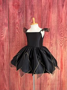 Little Darln Boutique  Black Fairytale Dress  This dress will make the perfect unique Halloween costume or birthday tutu dress for your princess. The blouse is made with black satin material, with spaghetti straps attached with sheer black sleeves, that consist with gold edging, a zipper can be found at the back of the bodice. The skirt is made of sheer/satin & gold edging to give it a fairytale princess silhouette. Underneath the skirt there is two layers of lining with crinoline to give it some fluffiness. Please message me if you are looking for a specific color to match your event.. Visit our store, more items to come!  https://www.etsy.com/shop/LittledarlnBoutique?ref=profile_header Black Princess Dress For Dress-up, Halloween Black Tulle Dress, Black Tulle Dress For Halloween, Black Satin Dress For Costume Party, Fitted Fairy Dress For Halloween Costume, Fitted Fairy Dress For Halloween Party, Fitted Fairy Dress For Halloween, Fitted Black Costume For Dress-up, Black Halloween Costumes For Dress-up