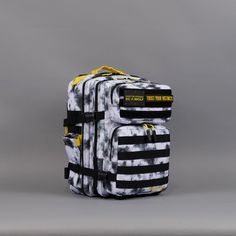 two pieces of luggage sitting on top of each other in front of a gray background