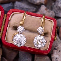 This stunning timeless pair of 18K yellow gold earrings are each accented with one (1) old European cut diamond set into a platinum eight-prong setting that dangles slightly, and one (1) old European cut diamond set into a four-prong platinum setting. The earrings measure 19.8mm X 7.9mm and are finished with lever backs for pierced ears. Antique Diamond Wedding Earrings, Classic Platinum Earrings With Rose Cut Diamonds, Classic Diamond Earrings With Rose Cut For Anniversary, Vintage Platinum Diamond Earrings For Wedding, Heirloom Brilliant Cut Diamond Earrings For Wedding, Vintage Diamond Earrings For Formal Occasions, Classic Formal Earrings With Rose Cut Diamonds, Classic Formal Rose Cut Diamond Earrings, Formal Classic Rose Cut Diamond Earrings