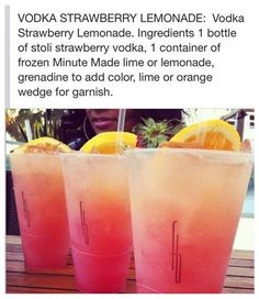 two glasses filled with lemonade sitting on top of a table next to each other