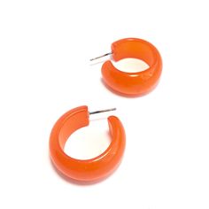 Orange hoop earrings in a vintage lucite and a moonglow finish. This style is known as the Leetie Bold Haskell Hoop & it's made with rare vintage parts - moonglow hoops that are authentically vintage are hard to find. These are a hand-dyed style & each hoop measures approximately 1" in diameter and about 15mm in width. This style is known as the Haskell hoop & is the perfect mix of retro and modern styles. The name pays homage to jewelry designer Miriam Haskell who was one of our fav Orange Small Hoop Earrings For Gift, Small Hoop Earrings Orange For Gift, Small Hoop Earrings In Orange For Gifts, Small Hoop Earrings Orange Gift, Handmade Vintage Small Hoop Earrings, Handmade Small Hoop Vintage Earrings, Nickel-free Orange Hoop Earrings, Retro Small Hoop Earrings Gift, Retro Small Hoop Earrings As Gift