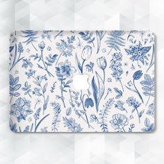 the blue and white floral pattern on this macbook air case is perfect for displaying