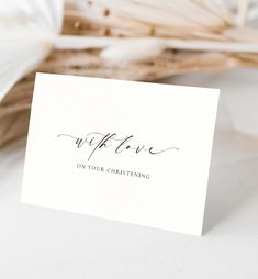 a close up of a card with the word wife on it next to some flowers