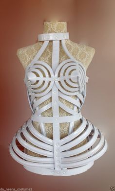 Madonna cone bra corset Made from metallic faux leather Comfortable to wear Available colors are black, white , and gold High quality, strong, and durable 10-14 day production time Please give us your bust and hip measurements after purchase Hand crafted by our professional maker Custom designs available -- just send us your design Madonna Costume, Cage Dress, Beaded Headpiece, Leotard Bodysuit, Corset Fashion, Afro Punk, Cone Bra, Mode Inspo, Adult Costumes