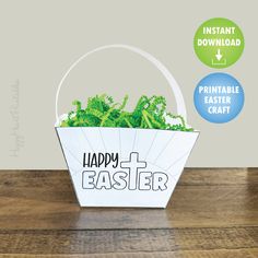 a white basket filled with plants sitting on top of a wooden table next to a sign that says happy easter