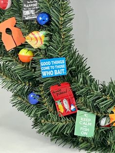 a christmas tree decorated with magnets and other things to help children learn how to use them