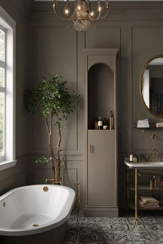 a bathroom with a tub, sink and large mirror in it's center area