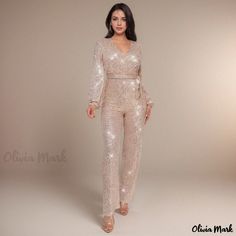 Olivia Mark - Elegant Long-Sleeve Jumpsuit with Belt in Stylish Deep V-neck Design Glamorous Gold V-neck Jumpsuits And Rompers, Gold Fitted Long Sleeve Jumpsuit/romper, Elegant Gold V-neck Jumpsuit, Jumpsuit With Belt, Cloth Belt, Halter Jumpsuit, Long Sleeve Jumpsuit, Olivia Mark, Deep V Neck