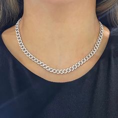 Heads will turn when wearing the Mini Gia Curb Link Pave Diamond Necklace. Handset pave diamonds glimmer and gleam from every angle. Metal: 18k White Gold / 18k Yellow Gold / 18k Rose Gold Round Brilliant Cut Natural Diamonds: Approx. 4.50 ctw G Color and VS-SI Clarity Diamonds Length: 15 inches Closure: Box Clasp Looking for a different length? Please email us. Fine Jewelry White Gold Curb Chain, White Gold Cuban Link Jewelry With Pave Setting, Silver Cuban Link Jewelry With Pavé Setting, White Gold Clavicle Tennis Necklace, White Gold Diamond Necklace With Chain, Elegant White Cuban Link Necklace, Cubic Zirconia Curb Chain Necklace, Fine Jewelry White Gold Clavicle Chain Necklace, Silver Tennis Necklace With Pave Setting For Formal Occasions