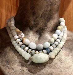 "This is a stunning trio of statement necklaces. Pale green jade gemstones necklace, worn together with egg shaped milky aquamarine stones and sliced milky aquamarine stones. All these create a stunning combination and a bohemian look. This necklaces can be worn together or separately and will work for everyday or with an evening dress. Each necklace can be purchased separately for $240 usd. Dimensions: length - 17\" - 19\" (including clasp) extender- can be added by request *If, for any reason, Handmade Elegant Amazonite Necklace, Elegant Amazonite Round Beads Jewelry, Elegant Round Bead Amazonite Jewelry, Elegant Round Beaded Amazonite Jewelry, Aquamarine Round Beads Jewelry With Natural Stones, Aquamarine Necklaces With Round Beads Of Natural Stones, Elegant Amazonite Gemstone Beads Jewelry, Aquamarine Necklace With Round Natural Stone Beads, Aquamarine Necklace With Natural Round Beads