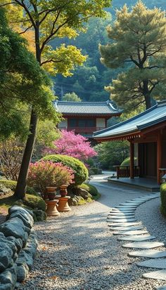 a stone path leading to a building with trees in the background