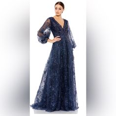 Beautiful Mac Duggal Gown With Sheer Sequin Embellished Embroidery Overlay. 100% Polyester Lining With A Partially Lined Bodice; Fully Lined Through Skirt And Sheer Unlined Puff Sleeves. Approximately 62.5” From Top Of Shoulder To Bottom Of Hem. Style # 20283 Blue Glamorous V-neck Gown, Glamorous Blue V-neck Gown, Blue Embellished Gown For Cocktail, Blue Embellished Cocktail Gown, Embellished Blue Cocktail Gown, Cocktail Embellished Blue Gown, Embellished Embroidery, Mac Duggal Dresses, Mac Duggal