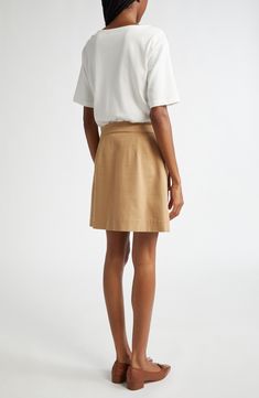 Take the guesswork out of getting dressed with this mixed-media mini fashioned with a soft white T-shirt over a structured A-line cargo skirt. Fronted with capacious bellows pockets, this one-and-done piece will take you anywhere. 34" length Hidden side-zip closure Boat neck Short sleeves Front flap-bellows pockets 100% cotton Dry clean Imported Chic Beige Relaxed Fit Skirt, A-line Skort For Workwear In Fall, Beige Skort For Workwear In Spring, Beige Skort For Spring Workwear, Beige Mini Skort For Workwear, A-line Skort For Workwear, Beige Relaxed Skort For Workwear, Linen Skirt For Workwear, Chic Cotton A-line Mini Skirt