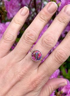 Choose your stone for this stunning dahlia turquoise sterling silver ring! These stones are orange, blue, purple, pink, and copper in color and have been set in sterling silver with a handmade ring band from sterling silver half dome wire. Each stone is 12mm in size. Made to order! Choose your stone and size for a custom ring! Please note that the stock rings are only available in the listed sizes below. Stock Ring 1 sizes 8-8.5. Stock Ring 2 sizes 6-6.5. Stock Ring 3 sizes 7.5-8. These turquois Multicolor Flower Ring As Gift, Multicolor Flower Ring Gift, Nickel-free Turquoise Ring As Gift, Nickel-free Turquoise Open Ring Gift, Multicolor Turquoise Round Ring For Anniversary, Nickel-free Turquoise Ring For Gift, Multicolor Turquoise Ring For Anniversary, Silver Turquoise Ring Round Band For Gift, Multicolor Turquoise Ring With Natural Stones As Gift