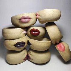 a group of ceramic sculptures made to look like they are hugging