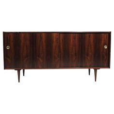 the sideboard is made out of wood and has two brass pulls on each side