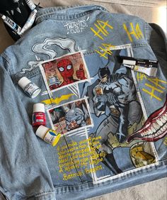 the back of a jean jacket with pictures and writing on it, including toothbrushes